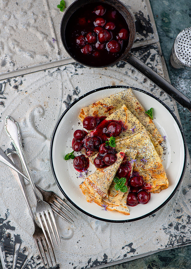 Poppyseed pancakes with cherry compote