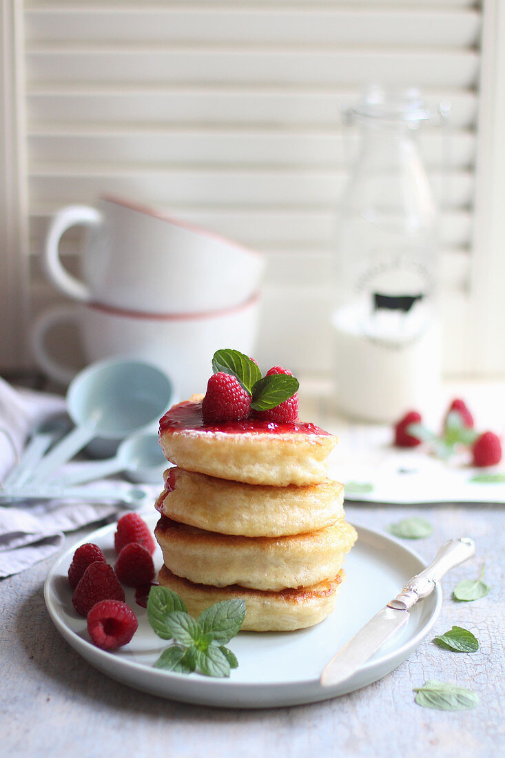 Pancakes with raspberry sauce and mint