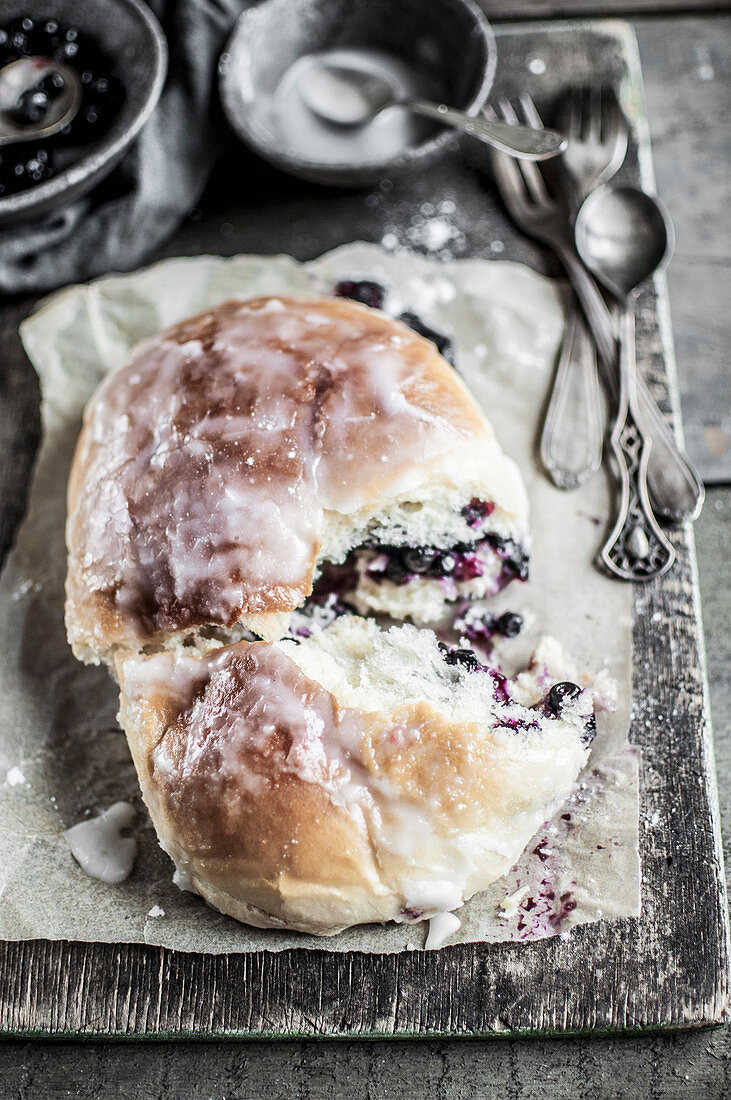 Homemade blueberry bun topped with icing