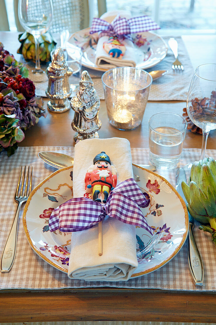 Table festively set with nutcracker lollipops on plates