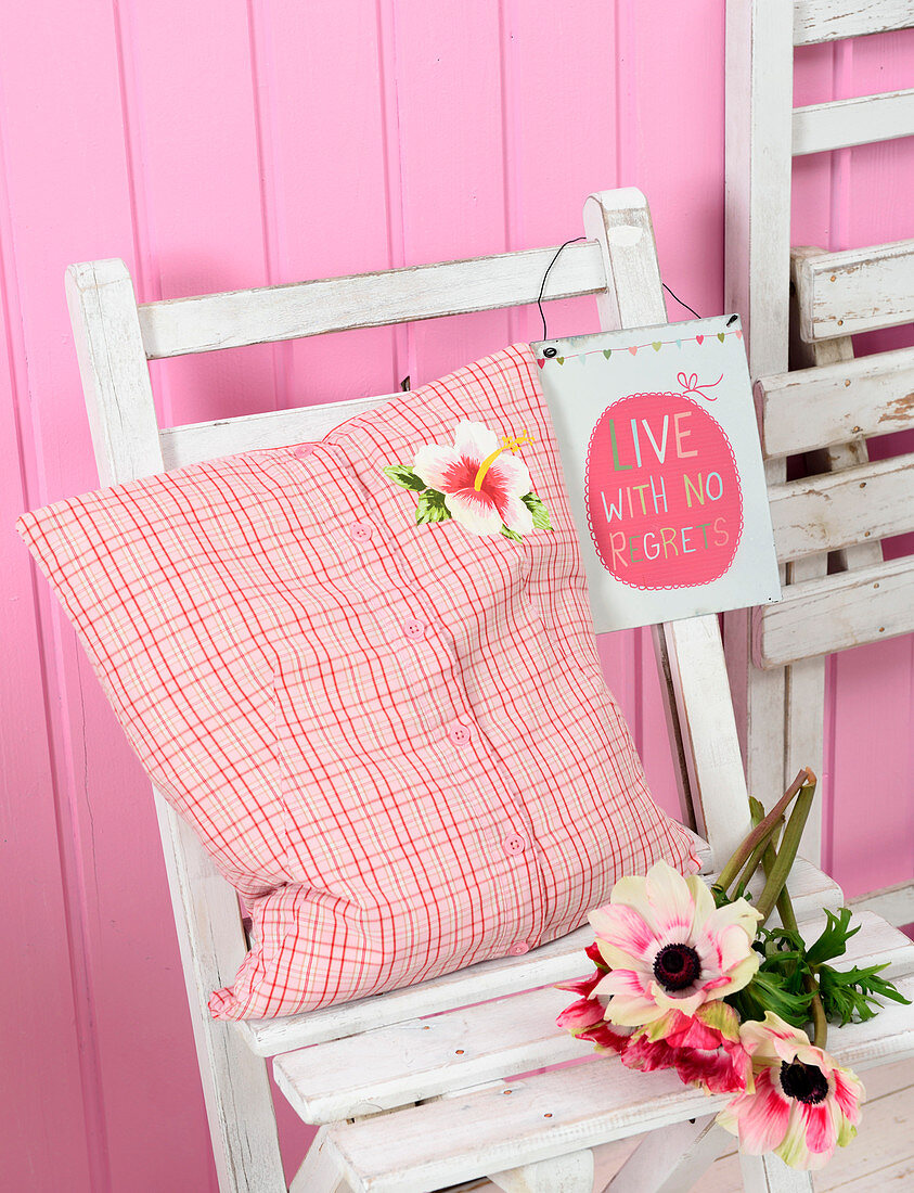 Hand-sewn cushion made from checked blouse with Hawaiian flower