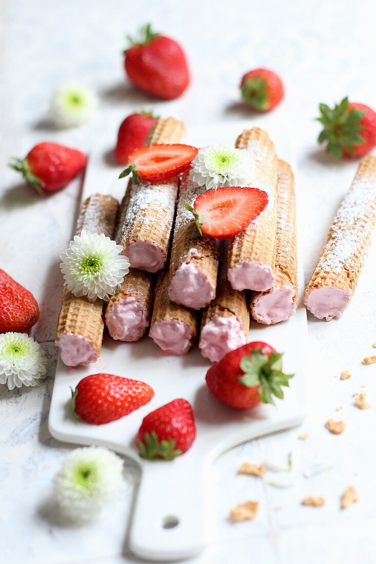 Wafer rolls filled with strawberry cream