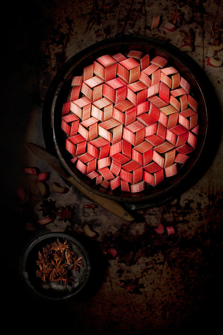 Chopped Rhubarb lain in a tesselation in a baking tin
