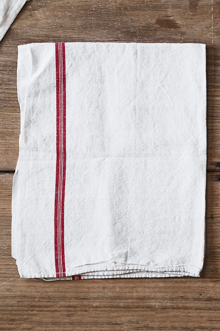 A tea towel on a wooden surface