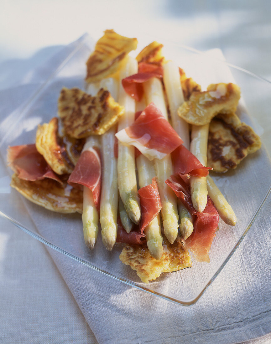 White asparagus with cured ham and pancakes