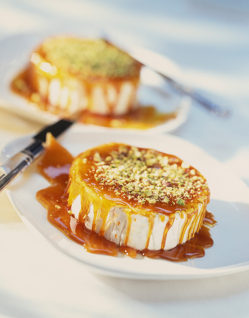 Camembert with a caramel sauce and pistachio nuts