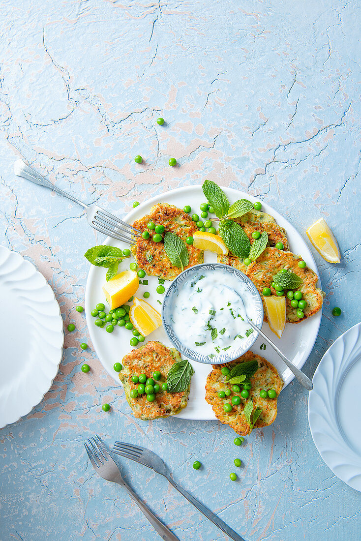 Courgette and pea fritters with lemon and minted yoghurt dip