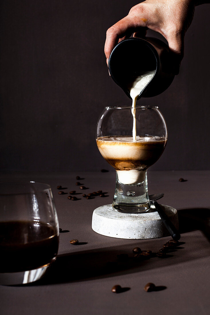 A coffee drink in a glass with milk