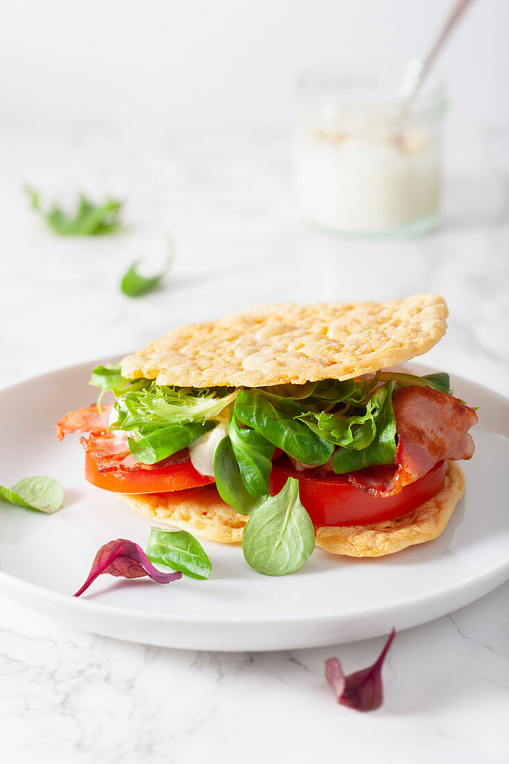 A bacon, lettuce and tomato sandwich on cloud bread (keto cuisine)