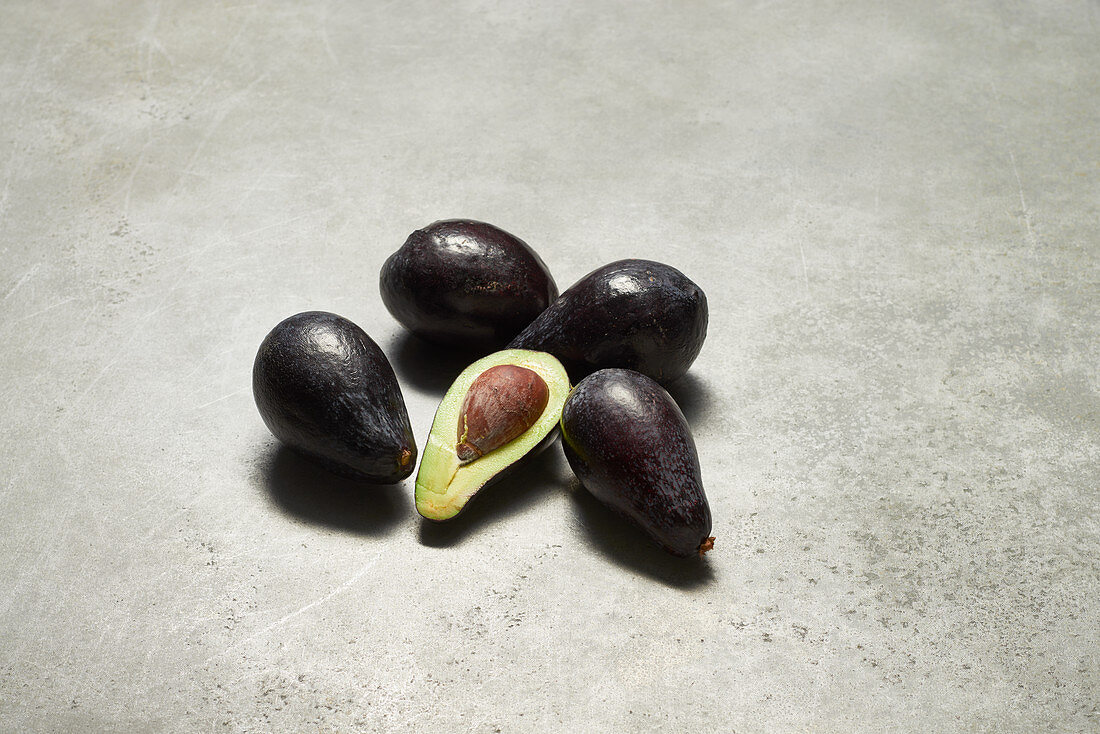 Wild avocados, whole and halved