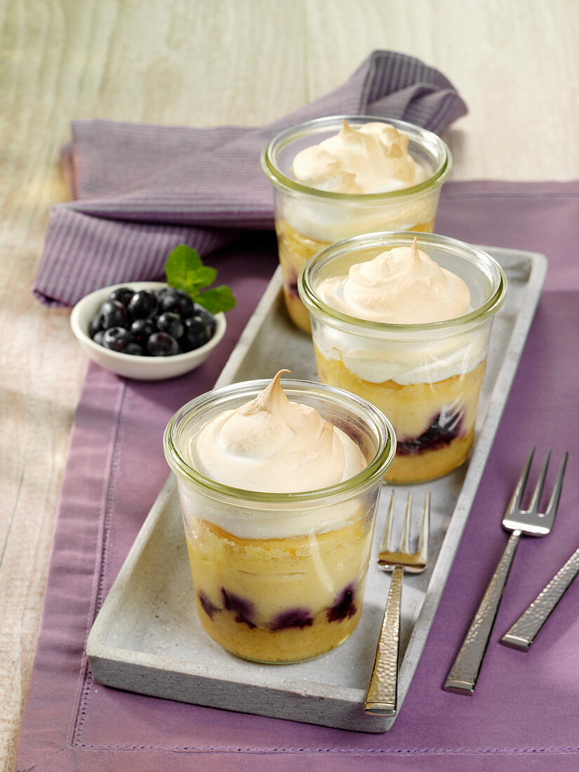 Mini cheesecake with blueberries and meringue baked in glasses