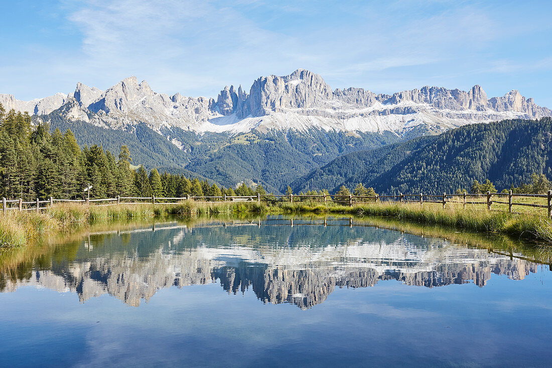 Wuhnleger pond with a view of the 'Rose Garden', South Tyrol, Italy