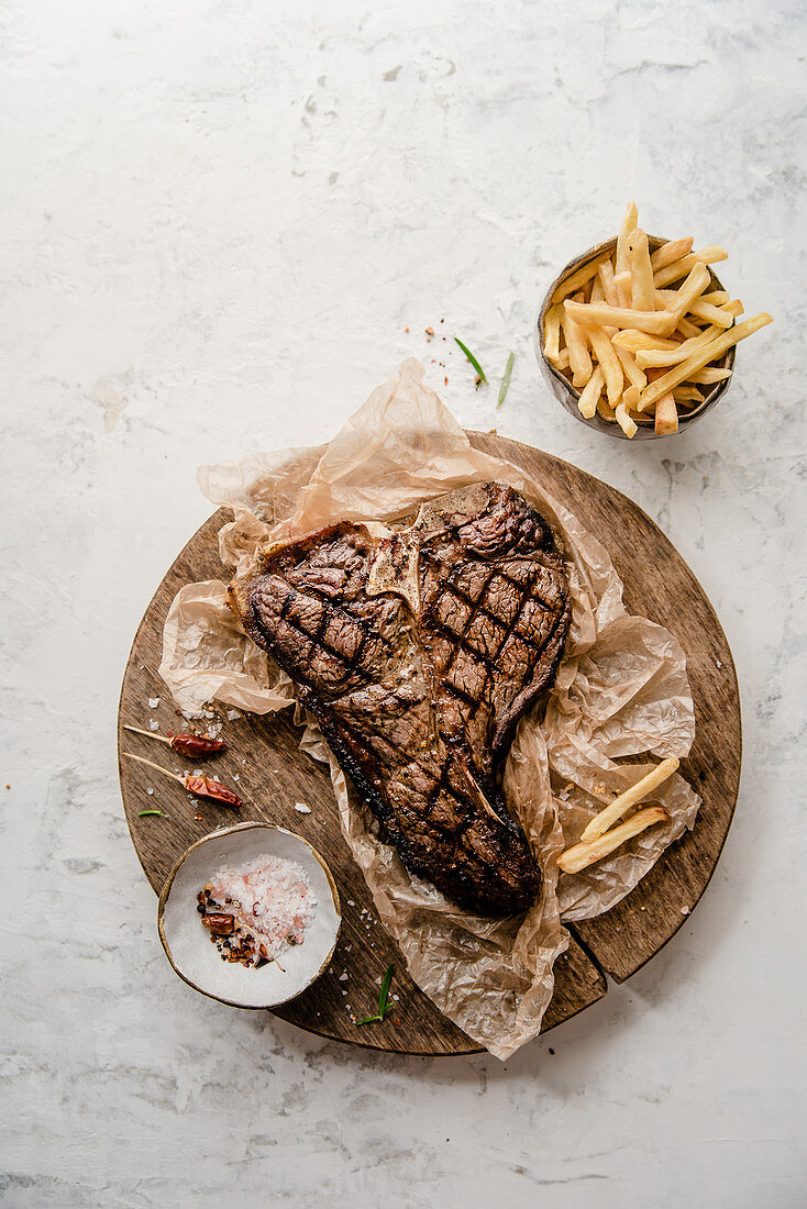 Grilled t-bone steak with chips
