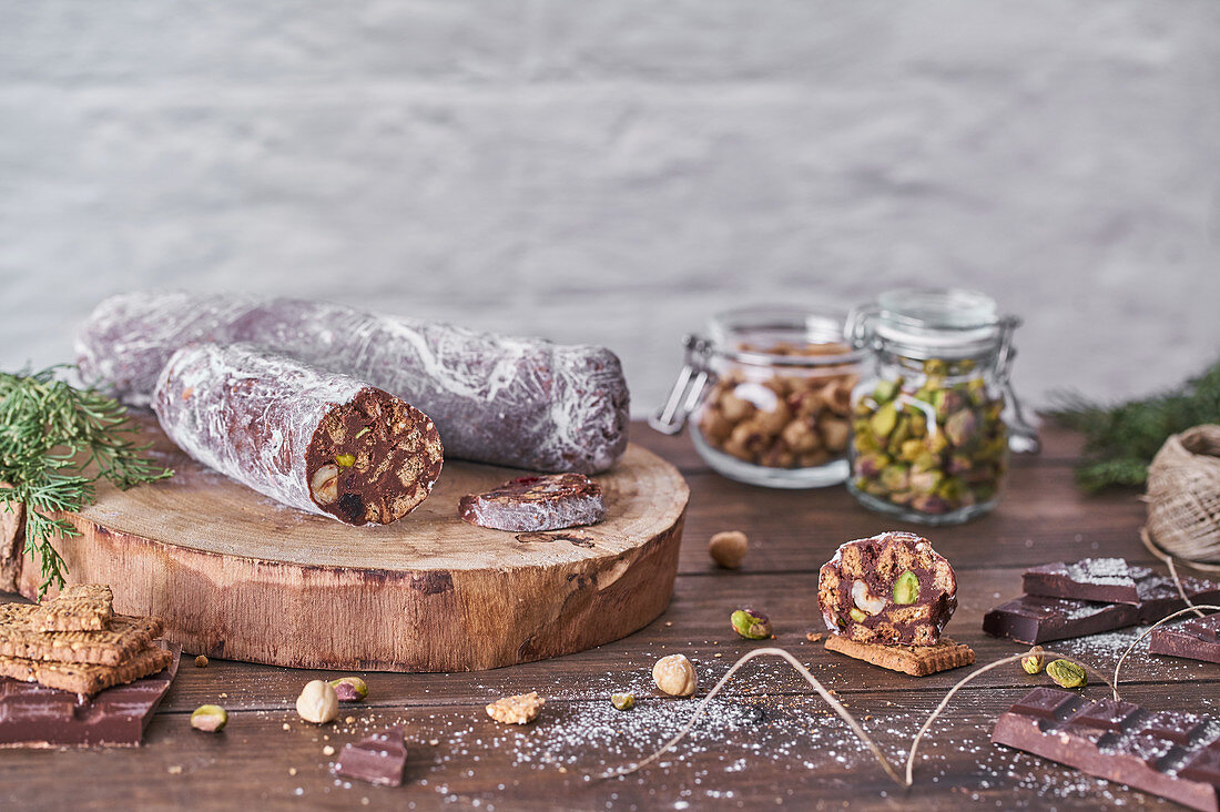 Traditional homemade chocolate salami with hazelnuts and pistachios