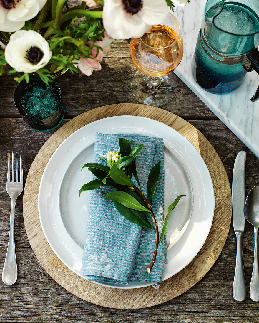 Place setting with a cloth napkin and flowers