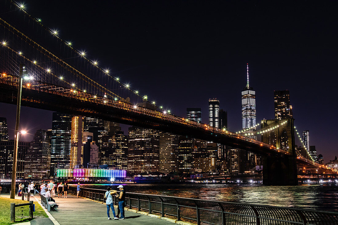 A view of Brooklyn Bridge lit up in the evening, New York City, USA