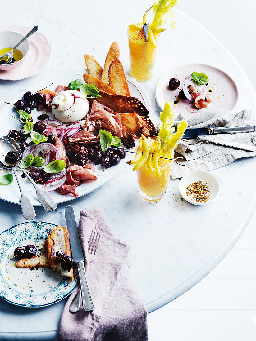 Burrata, mulled cherries, prosciutto, basil salad and 'Mango Mary'