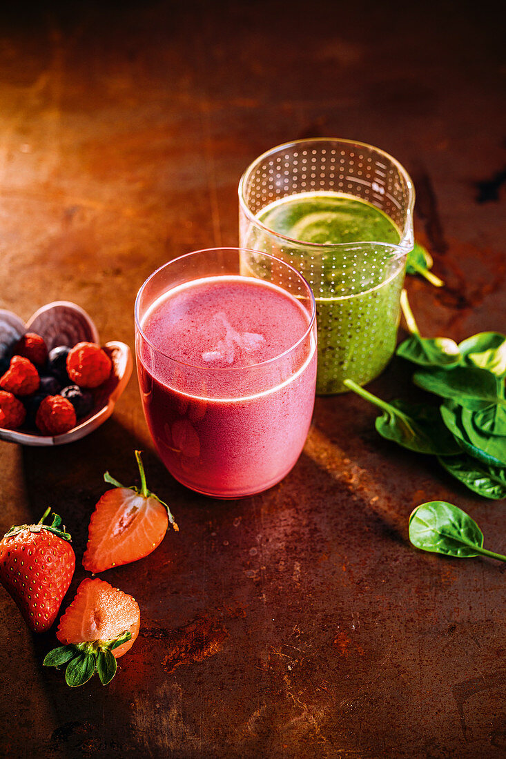 A Popeye green smoothie and a 'Berry Me' smoothie