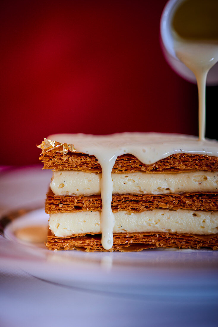 Millefeuille with gold leaf and vanilla sauce