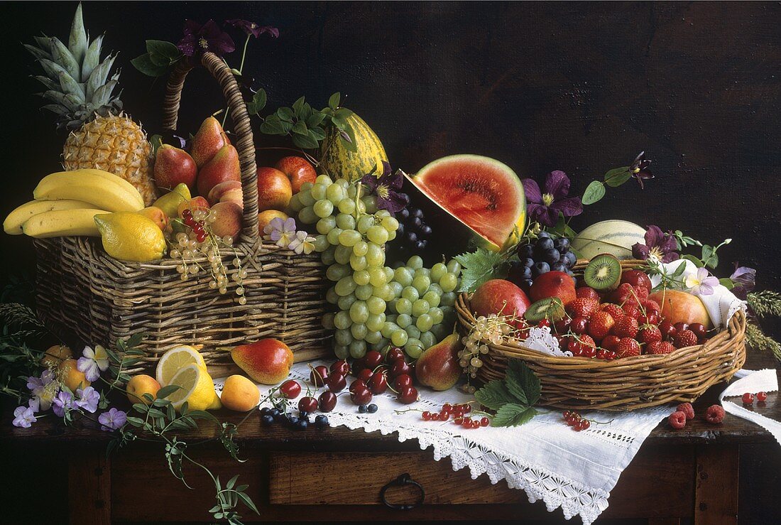 Fresh fruit in basket and bowl on old table