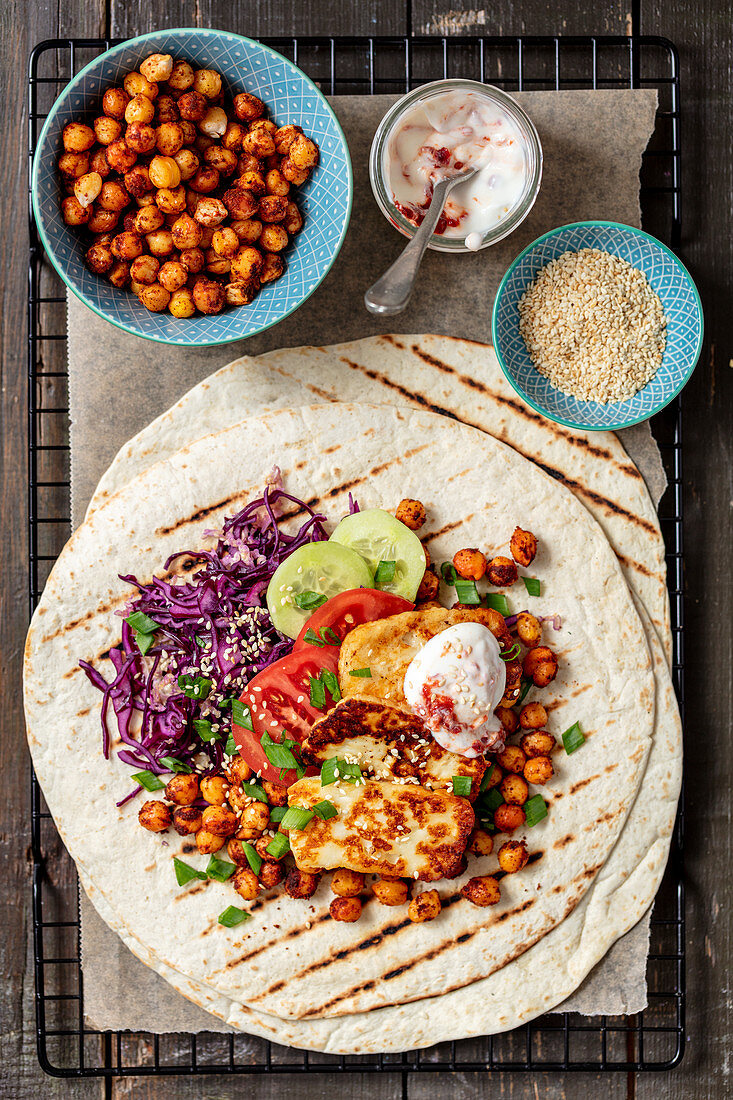Tortilla wrap with baked chickpeas and halloumi cheese