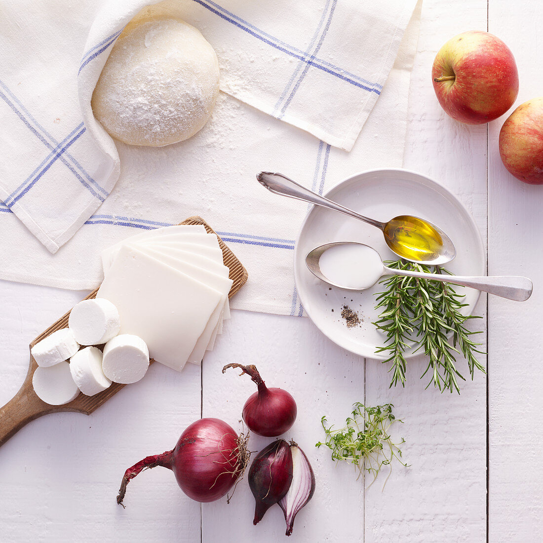 Ingredients for tarte flambée with apple, onions and goat’s cheese