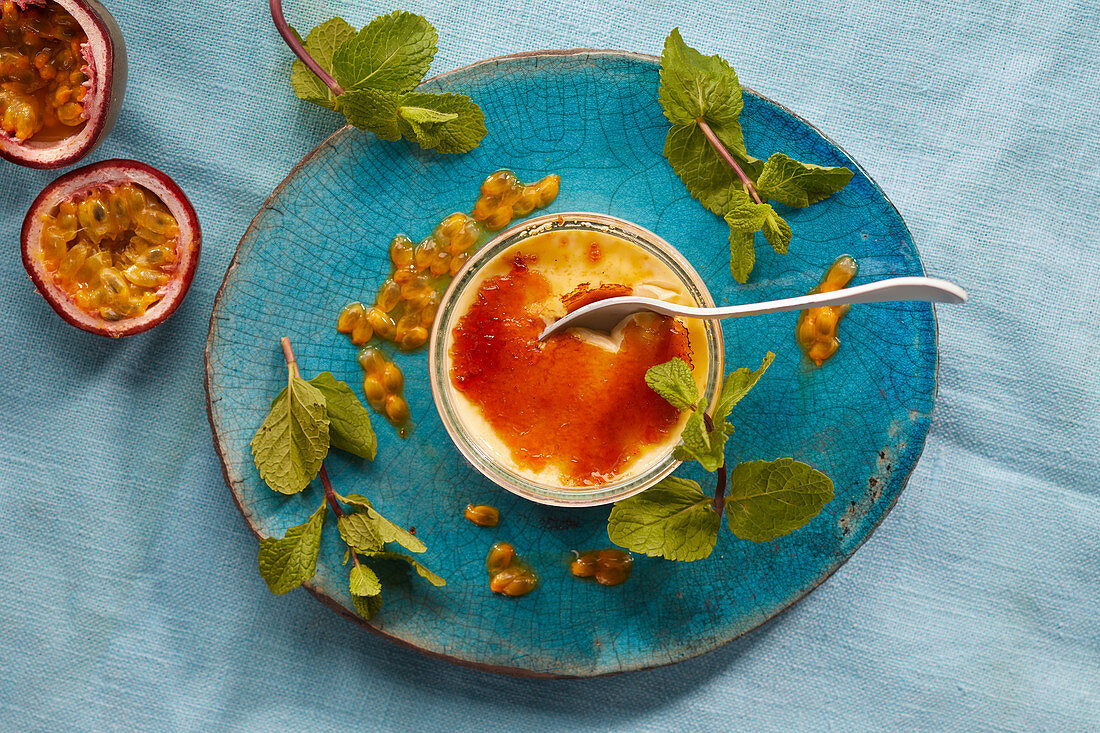 Creme brulee with passion fruit sauce