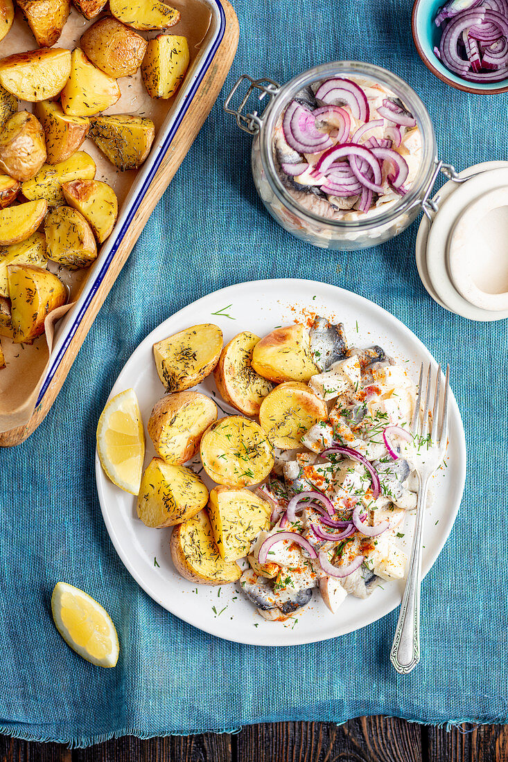 Herring salad with apple and baked potatoes