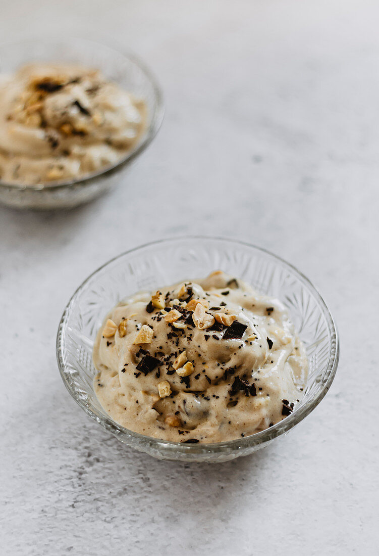 Banana ice cream with grated chocolate and peanuts