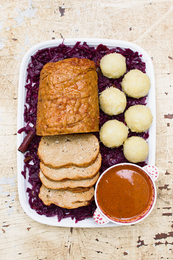 Vegan Sauerbraten with potato dumplings and red cabbage