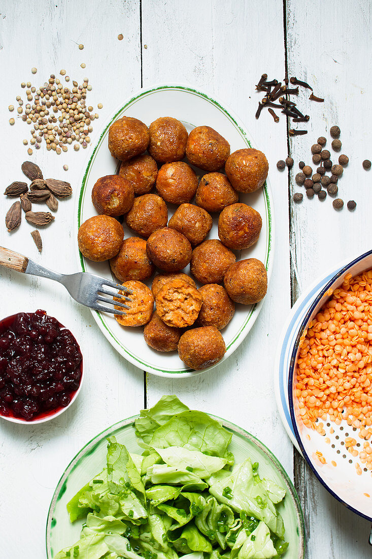 Spicy lentil balls with cranberries and lettuce