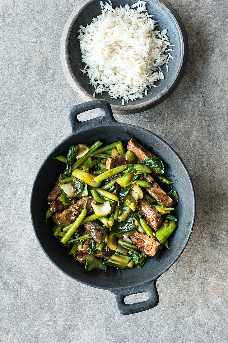 Green stir-fried vegetables with rump steak served with rice