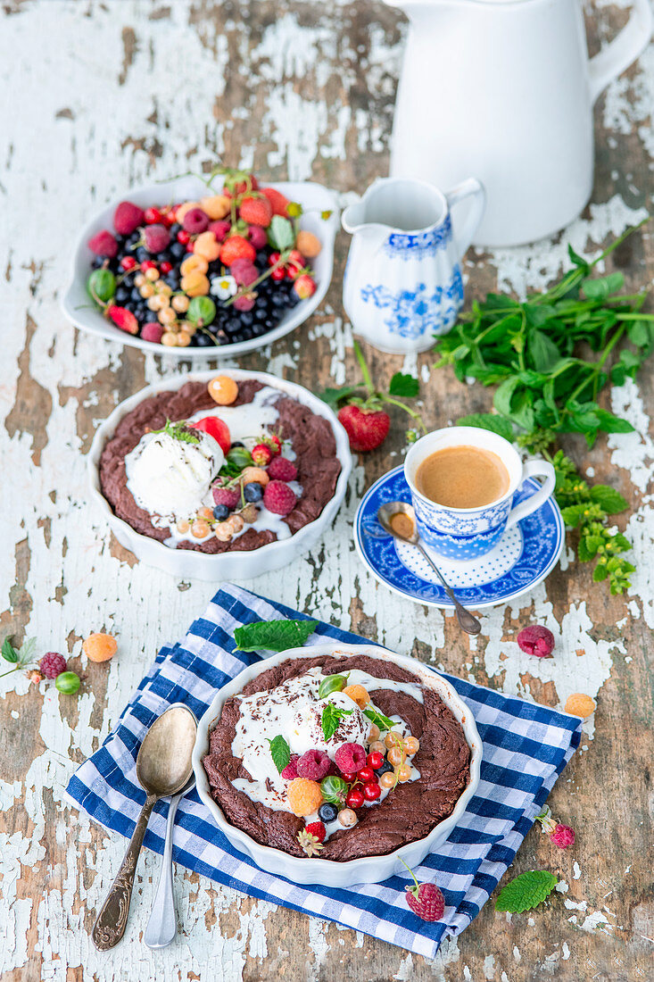 Hot chocolate cakes with berries and ice cream