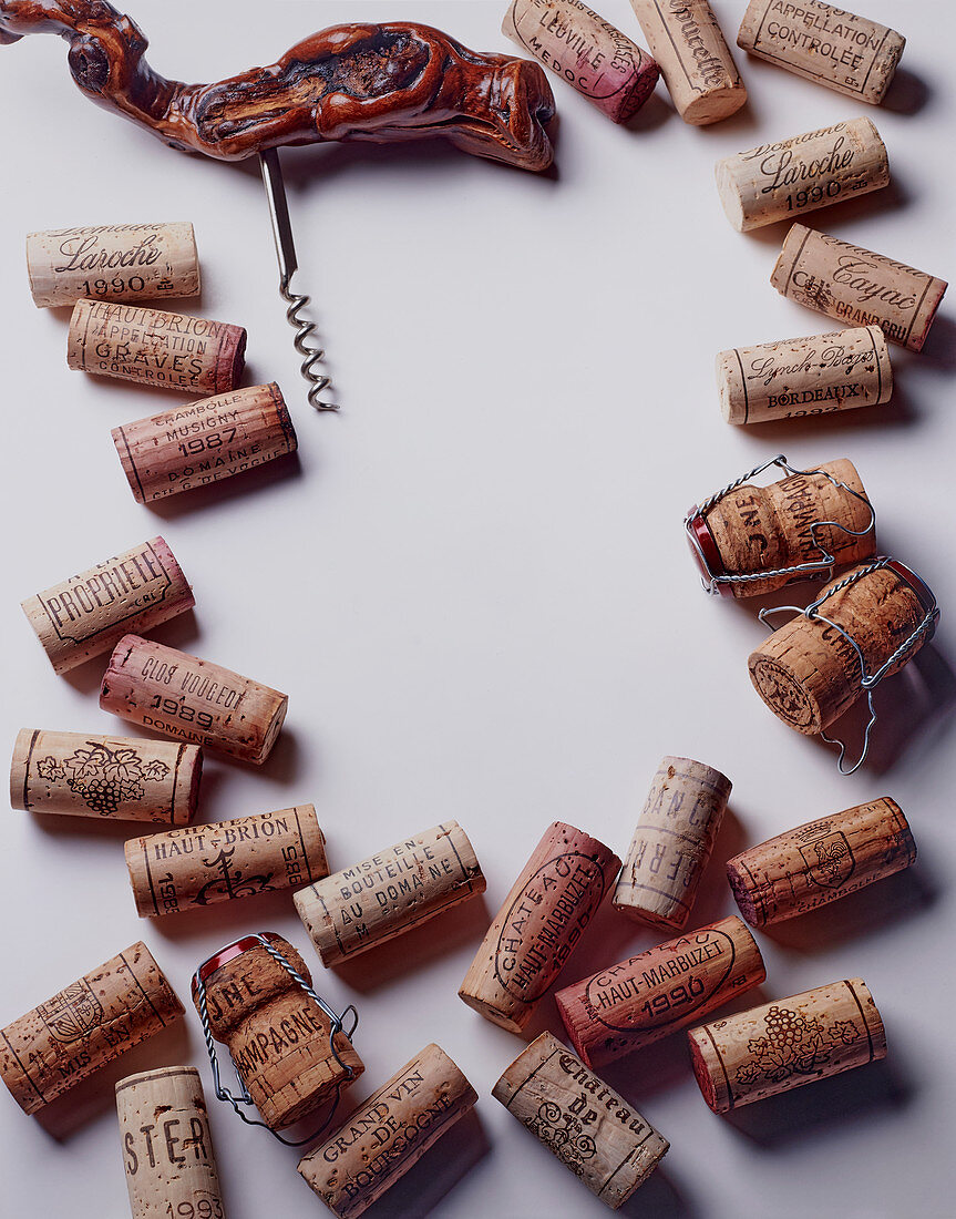 Different wine corks with a corkscrew