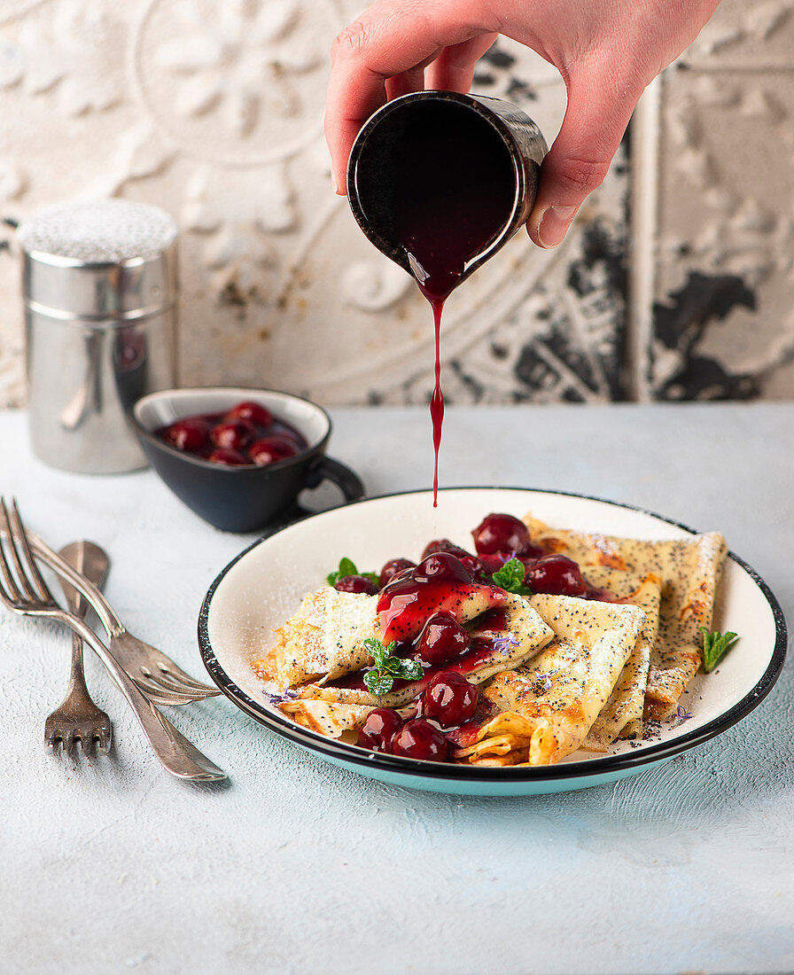 Poppyseed pancakes with cherry compote
