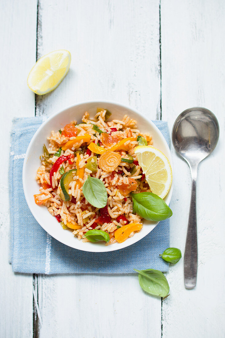 Vegan rice salad with zucchini and peppers