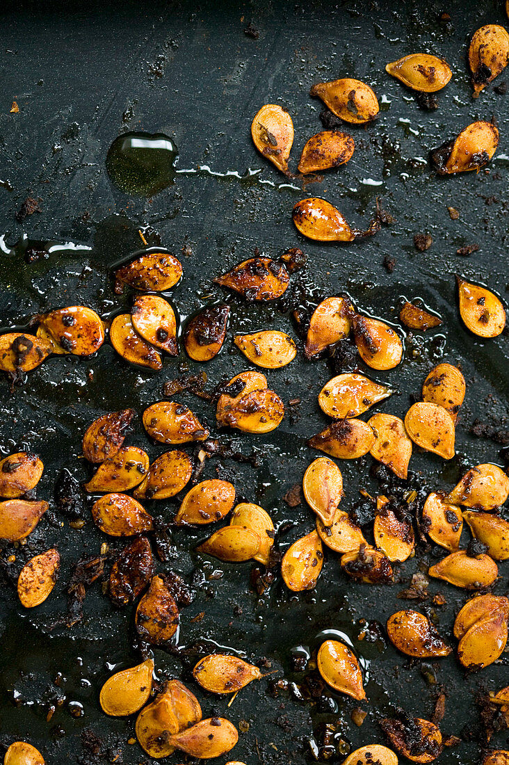 Roast butternut squash seeds with chilli