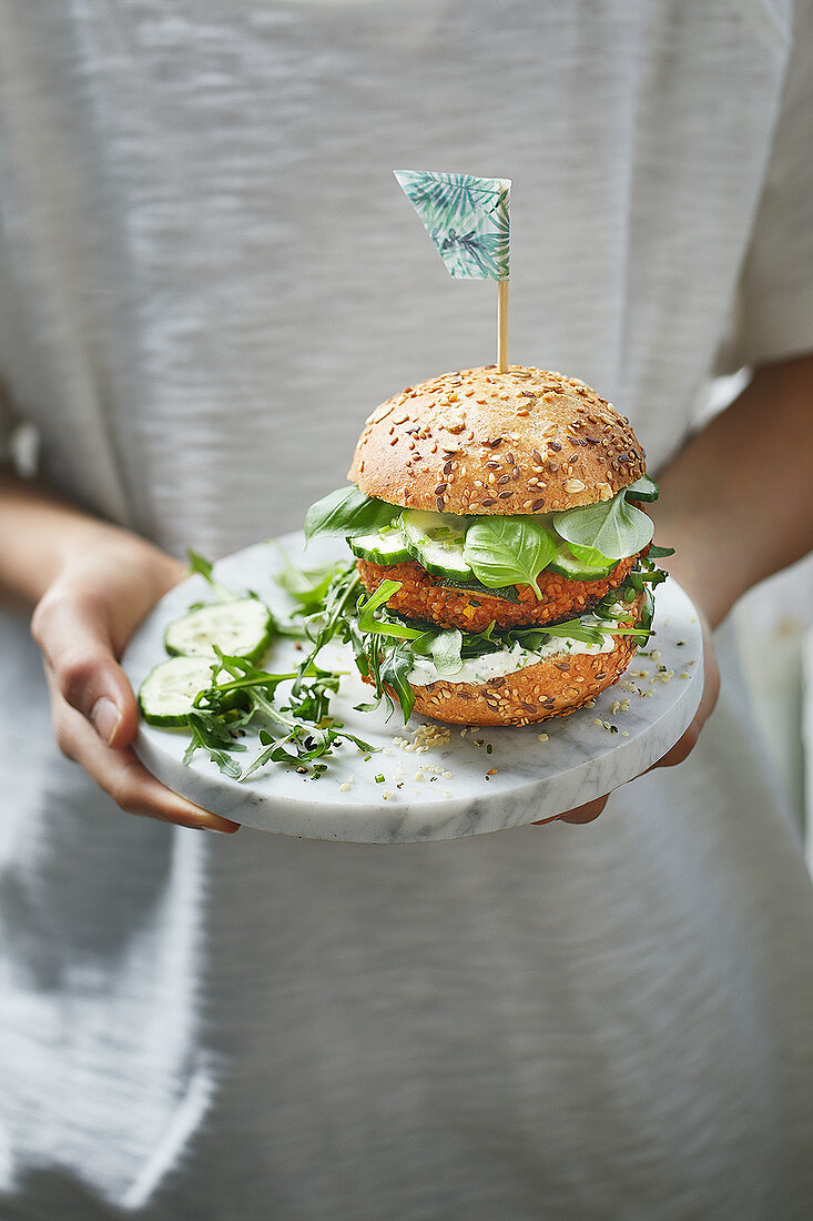 Vegetable bulgur wheat patty in a multigrain roll with cucumber and rocket