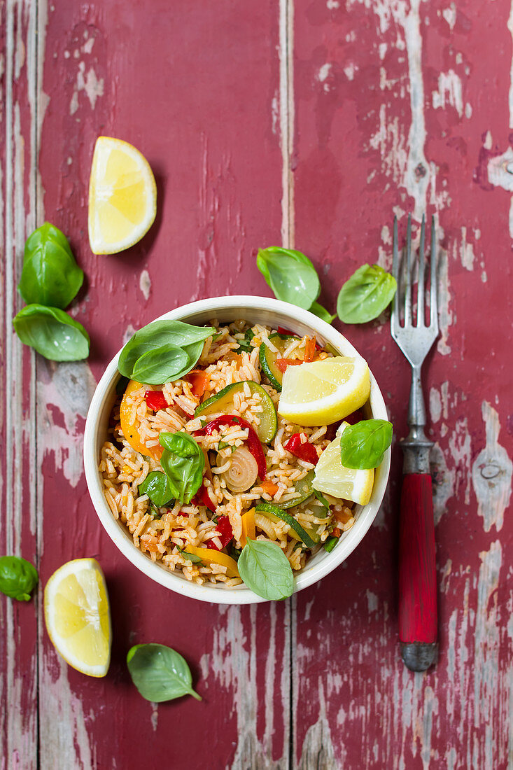 Vegan rice salad with zucchini and peppers