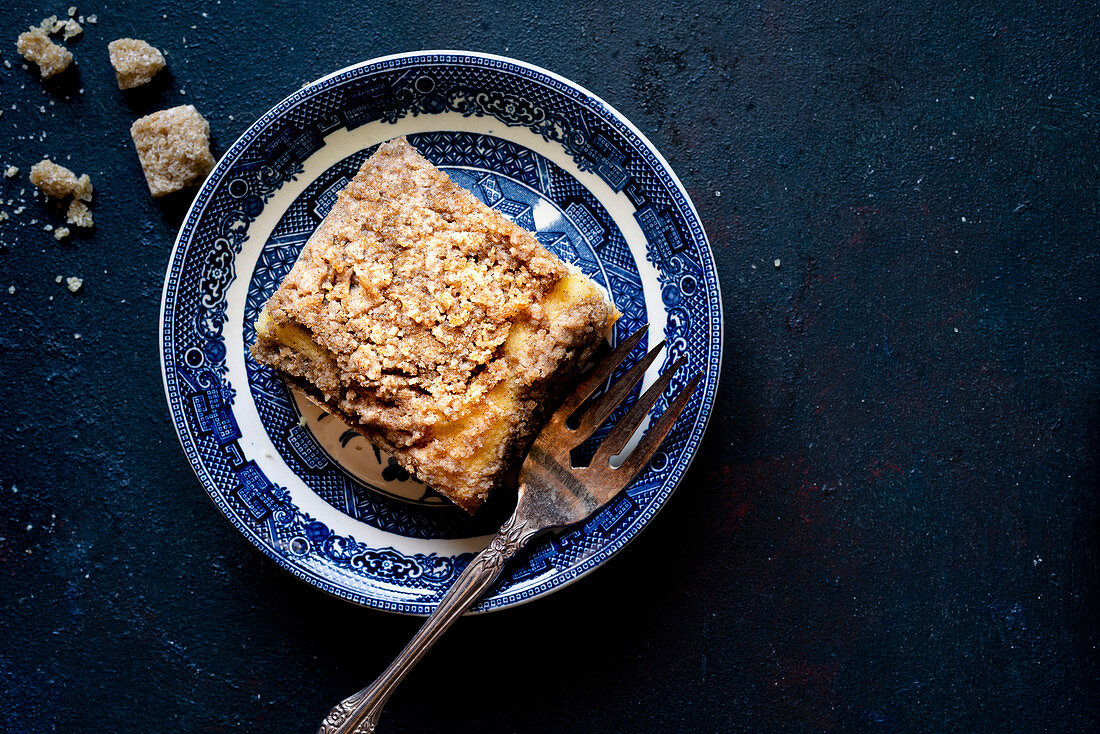 Gluten-free Coffee Cake with Coffee against a dark blue background