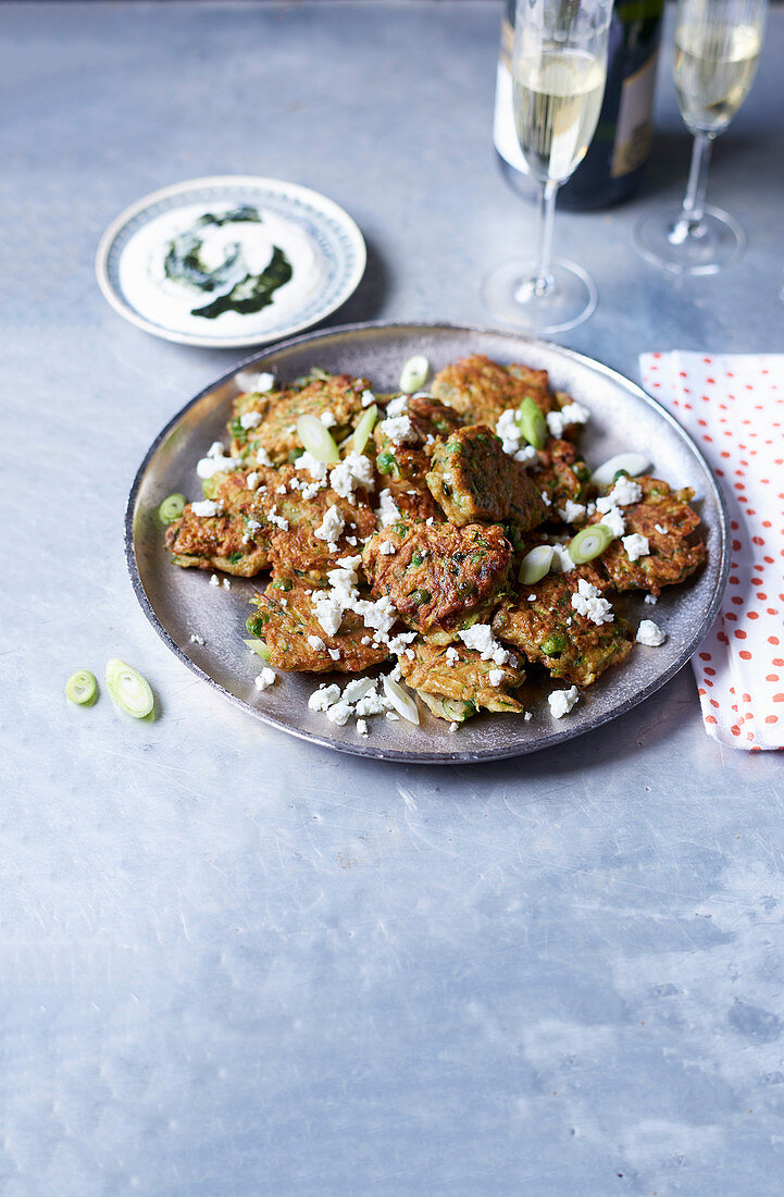 Spiced pea and courgette fritters with minty yoghurt dip