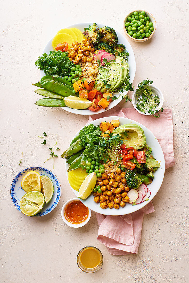 Healthy vegetarian lunch bowl with avocado, chickpeas, quinoa, microgreens and vegetables