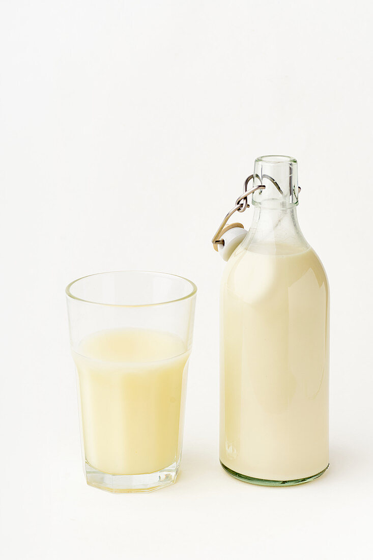 Rice milk in a glass and flip-top bottle