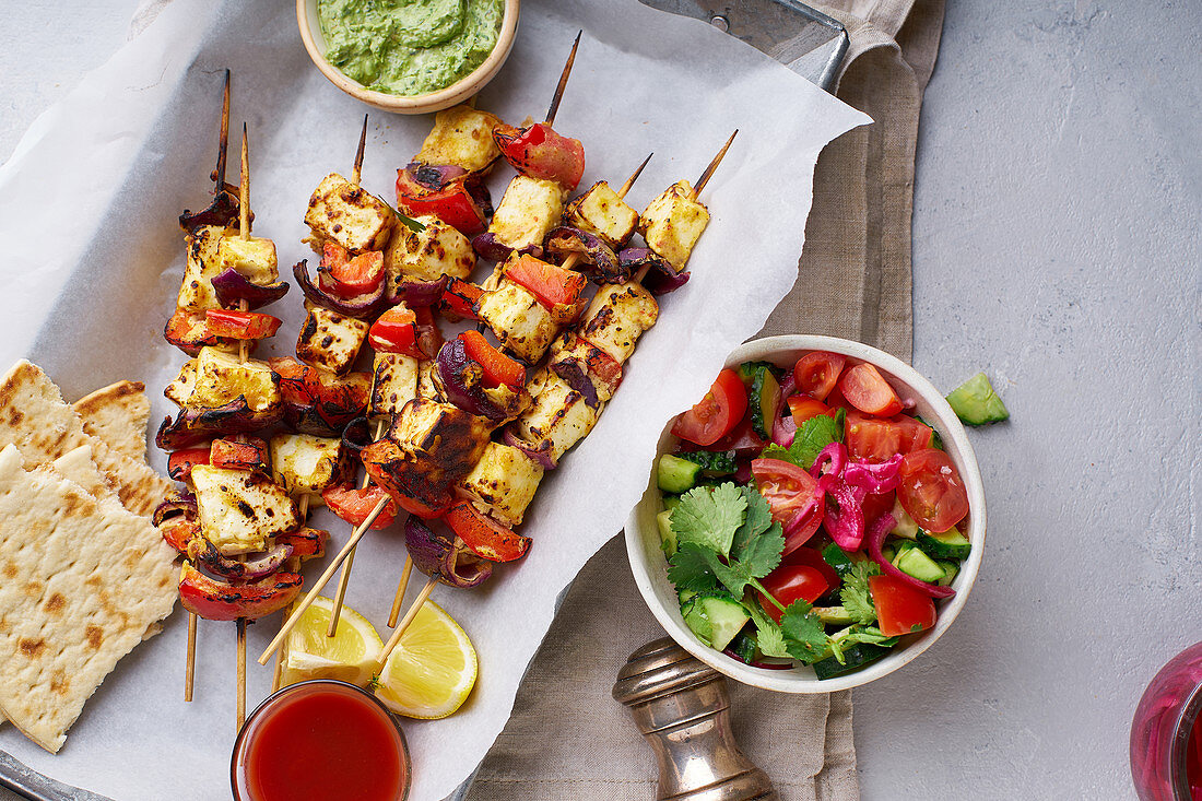 Grilled onion and pepper paneer skewers with peppermint sauce and salad