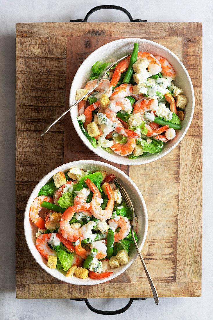 Prawns with green salad and dill dressing.