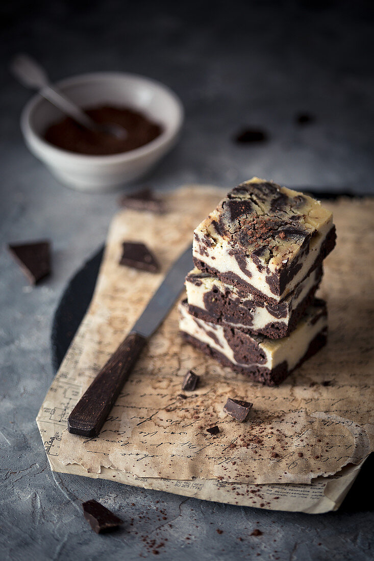 Stack of vegan tofu cheesecake brownies