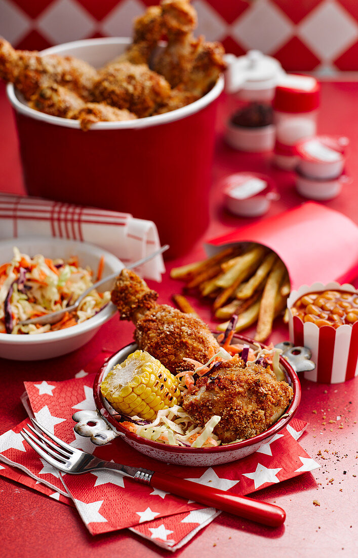 Baked chicken with corn, lettuce and french fries