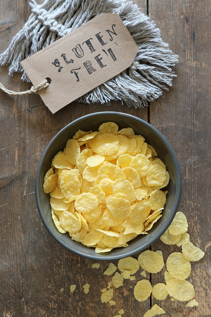 Gluten-free cornflakes in a grey bowl