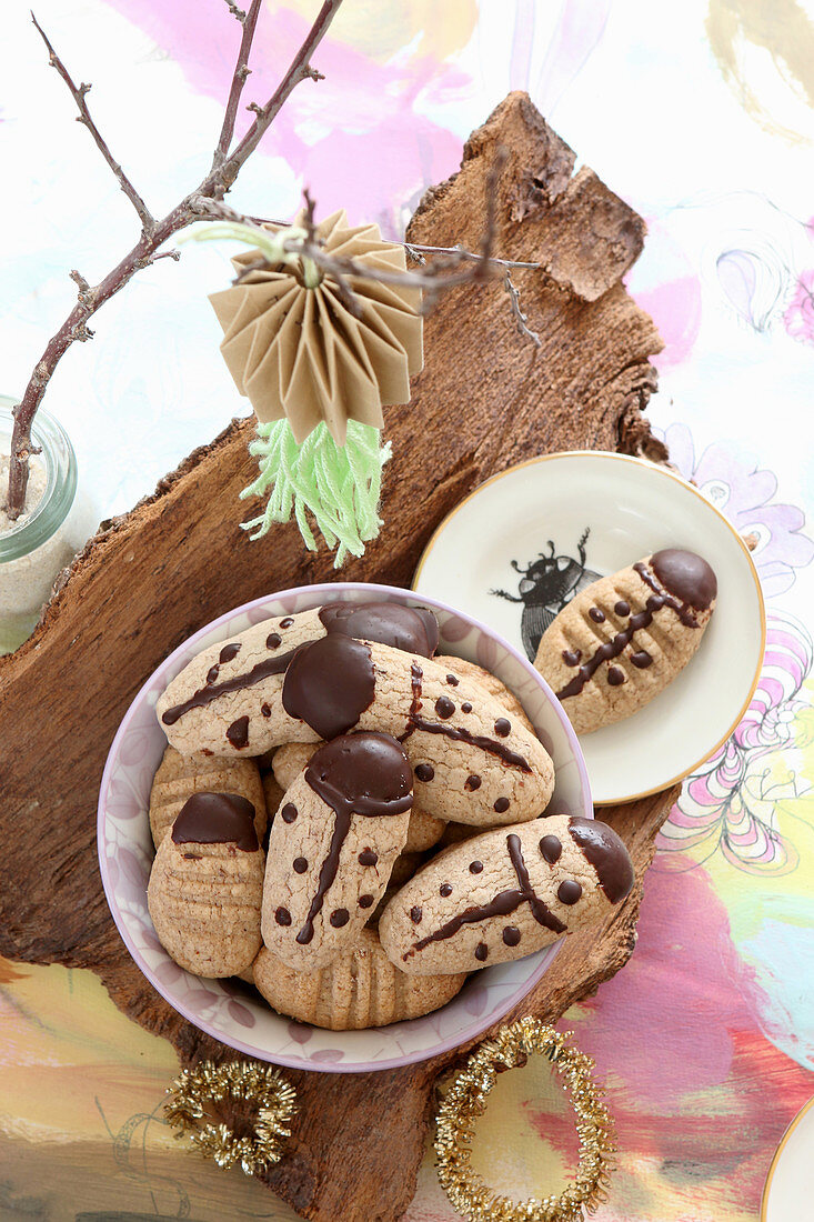 Gluten-free ladybird biscuits decorated with dark chocolate