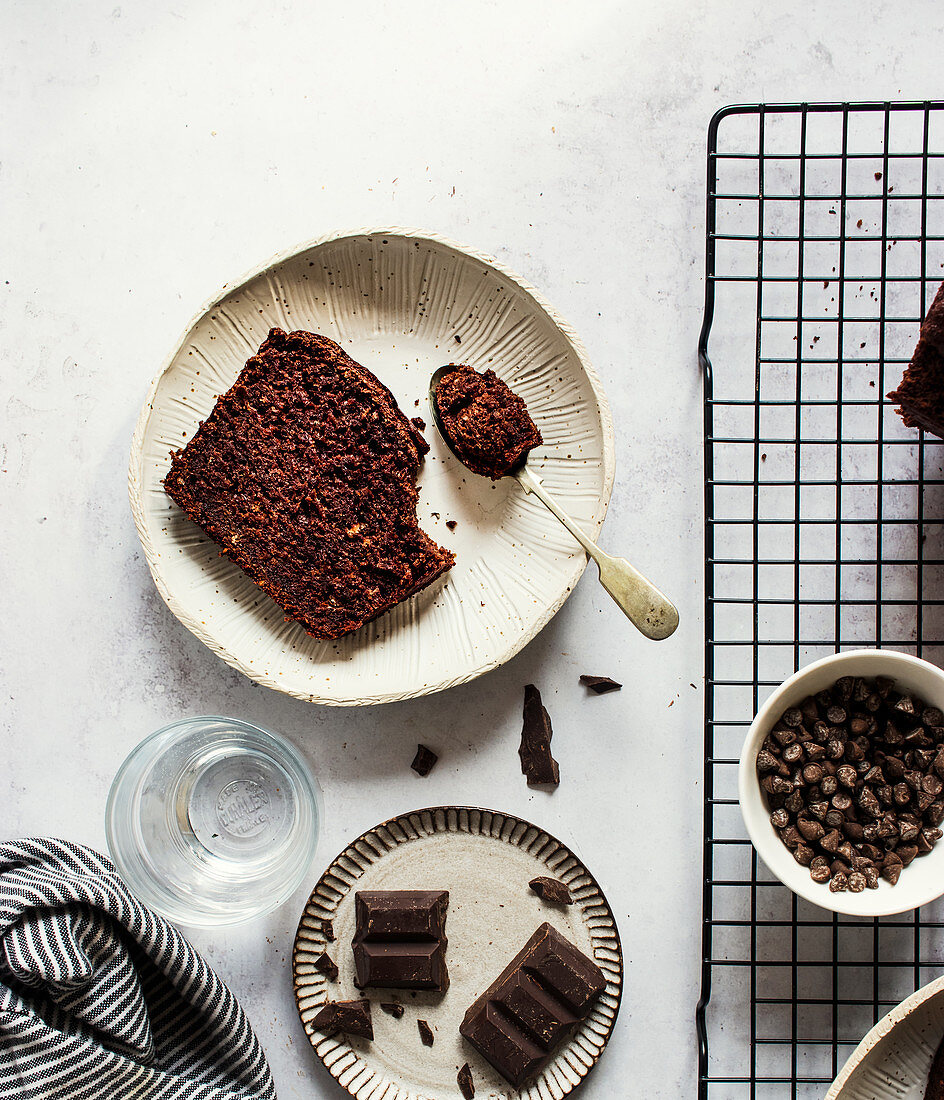 Piece of sweet banana and chocolate cake placed on table